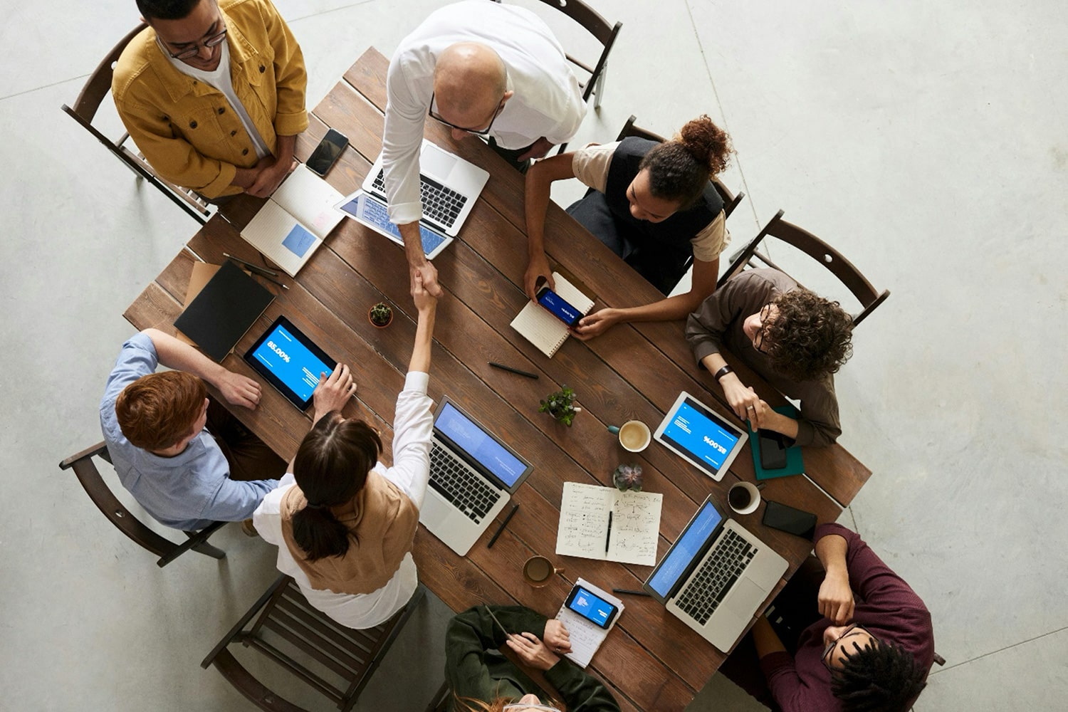 A group of professionals sitting around a table at a meeting